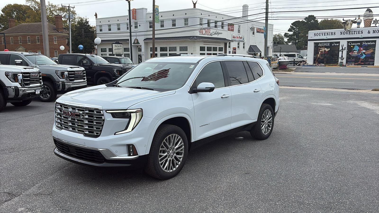 2026 GMC Acadia Denali in Glacier White Tricoat — front three-quarter view