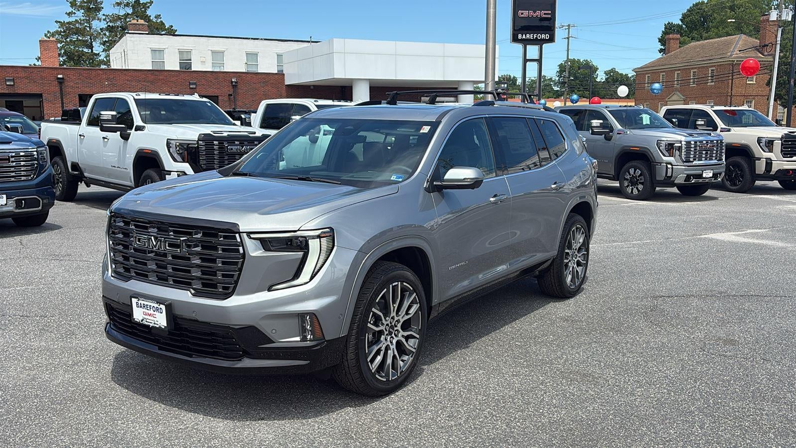 2026 GMC Acadia Denali Ultimate in Sterling Metallic — front three-quarter view