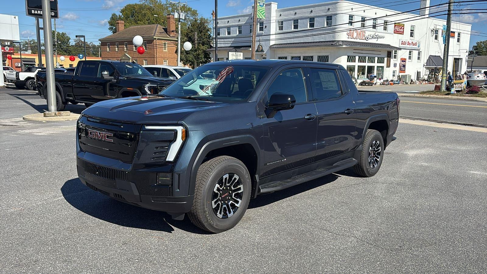 2026 GMC Sierra EV Elevation Standard Range in Deep Ocean Metallic — front three-quarter view
