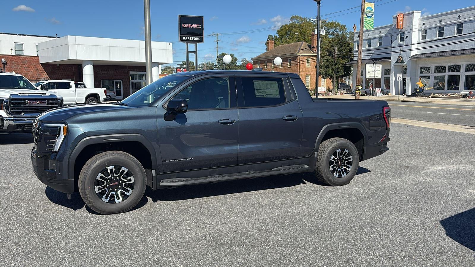 2026 GMC Sierra EV — rear three-quarter view