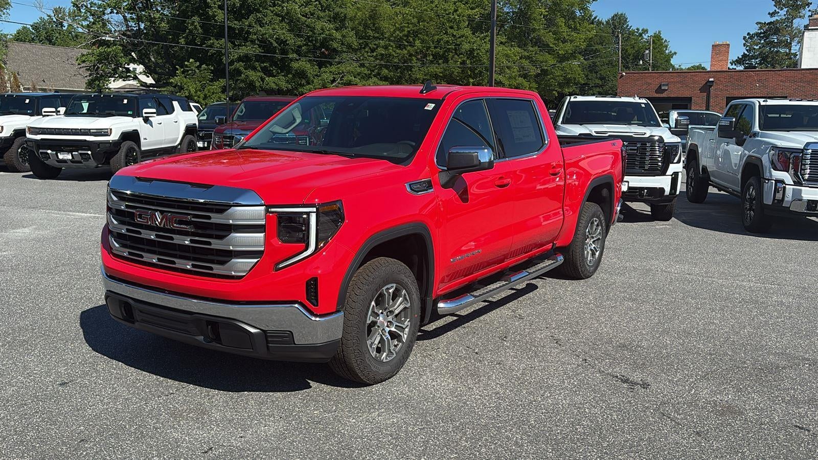 2026 GMC Sierra 1500 SLE in Cardinal Red — front three-quarter view